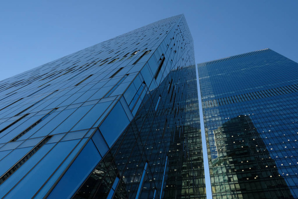 low angle view of business buildings against blue sky - Fotografie, Obrázek