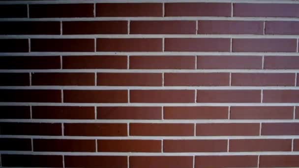 Wall composed by 10 rows of bricks with light coming from the right and shadows on the left side - Footage, Video