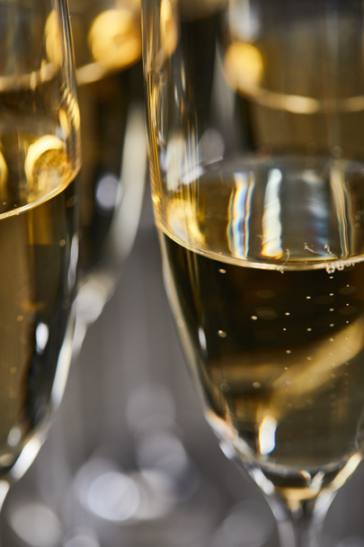 close up of sparkling wine in glasses for celebrating christmas eve  - Fotografie, Obrázek