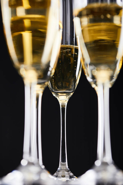 glasses of sparkling wine for celebrating christmas, isolated on black  - Foto, immagini