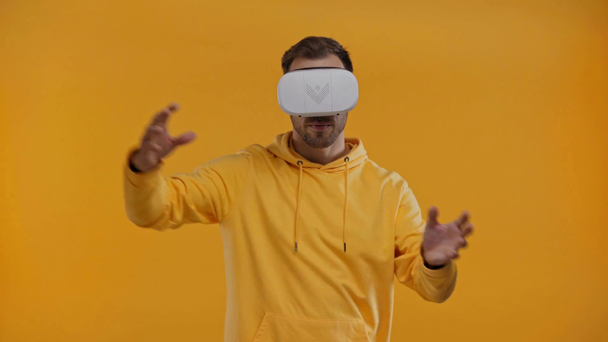 man with virtual reality headset isolated on yellow - Filmmaterial, Video