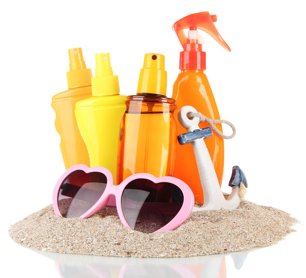 Bottles with suntan cream and sunglasses, isolated on white - 写真・画像