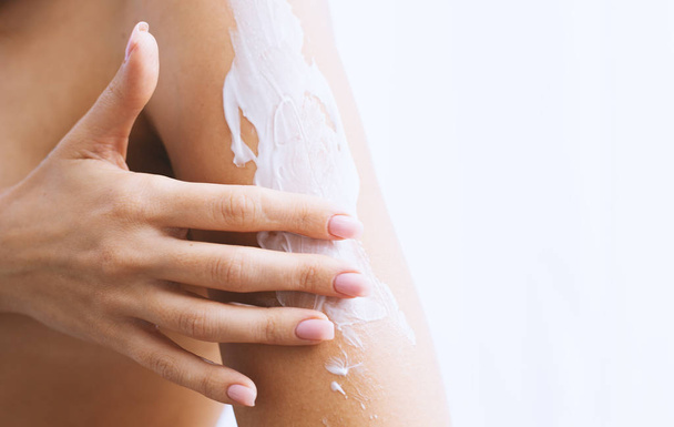 Woman Applying Cream On Skin. - Photo, Image