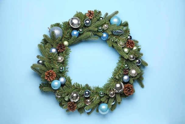 Beautiful Christmas wreath on color background - 写真・画像
