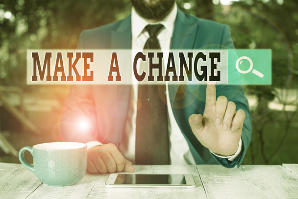 Text sign showing Make A Change. Conceptual photo Create a Difference Alteration Have an Effect Metamorphose Businessman with pointing finger in front of him. - Photo, Image