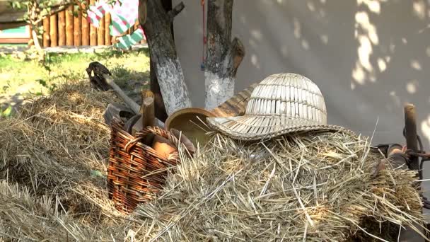 Old straw hat lying in the ethnographic museum as an exhibit of home clothes - Footage, Video
