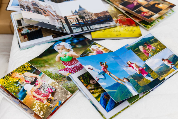 Photo albums with photos lying on white surface - Photo, Image