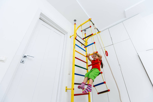 little girl climbing a ladder - Photo, Image