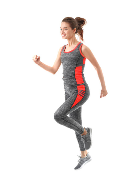 Sporty running young woman on white background - Photo, Image