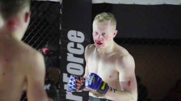Fight in the MMA octagon. Slow motion. Kyiv. Ukraine - Felvétel, videó