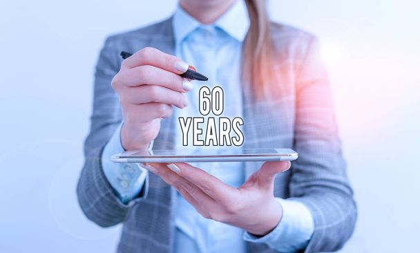 Handwriting text 60 Years. Concept meaning It is the onset of a golden era Commemorating a special day Business concept with mobile phone and business woman. - Photo, Image