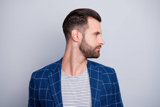 Close-up profile side view portrait of his he nice serious attractive bearded guy wearing checked blazer looking aside isolated over light grey pastel color background - Foto, Imagem