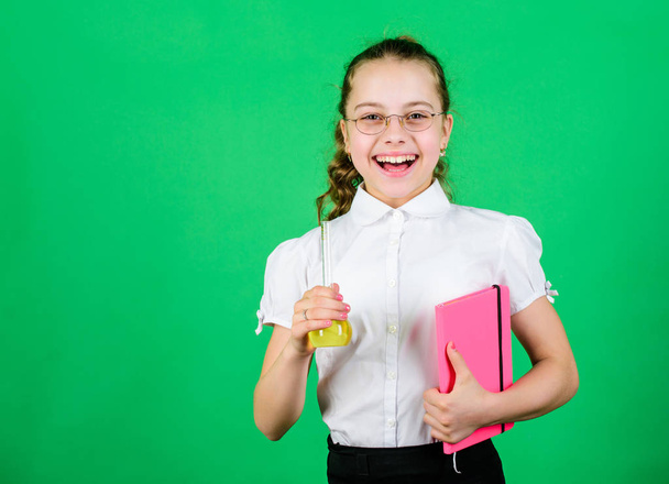 science research in lab. Small school girl. education and knowledge. small smart girl with testing flask. child study bilogy lesson with note. back to school. Medicines you can trust - Fotografie, Obrázek