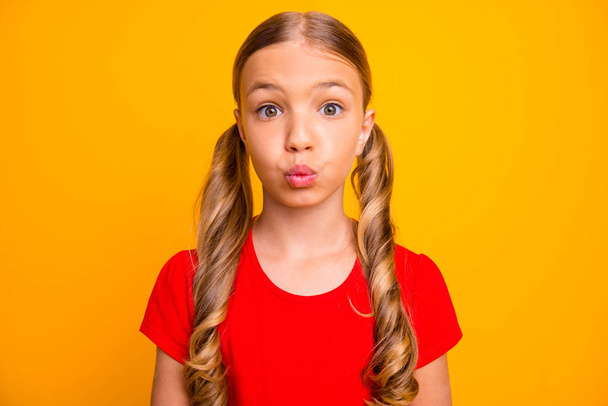 Closeup photo of charming pretty little lady inspired good mood sending air kisses classmate boy guy shy person wear casual red t-shirt isolated bright yellow color background - Foto, immagini