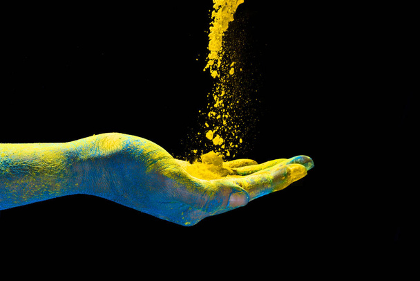 Χέρι κρατώντας πολύχρωμο σκόνη για holi. Γιορτή χρωμάτων - Φωτογραφία, εικόνα