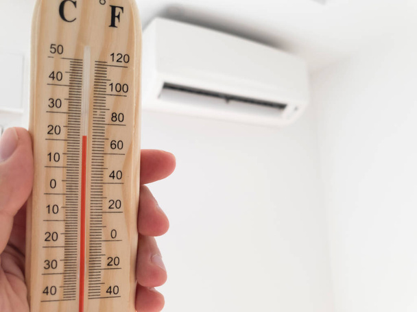 Thermometer and temperature measuring with modern air condition  - Photo, Image