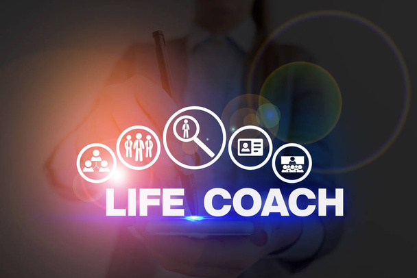 Handwriting text Life Coach. Concept meaning someone who helps identify your goals and plan to achieve them. - Photo, Image