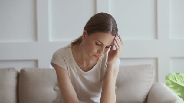 Worried insecure lady thinking of problem sitting alone at home - Imágenes, Vídeo