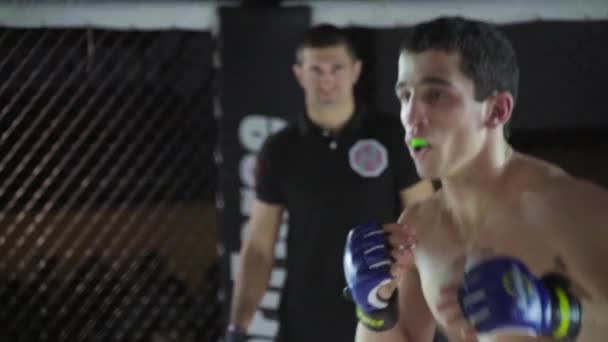Fight in the MMA octagon. Slow motion. Kyiv. Ukraine - Materiał filmowy, wideo