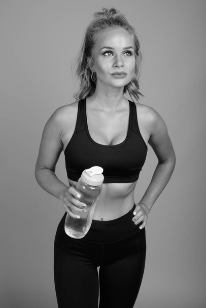 Young beautiful woman ready for gym in black and white - Photo, Image