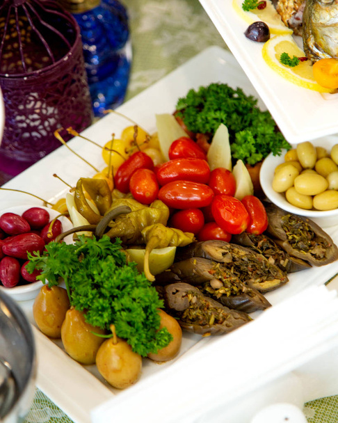 pickles platter with stuffed aubergine, tomato, cucumber, plum and pepper - Foto, Imagem