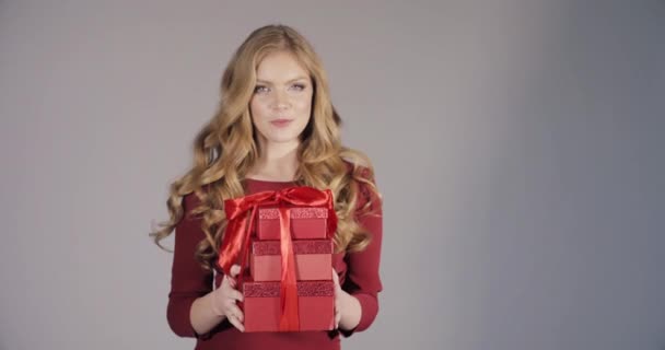 Beautiful blonde lady in bordo dress getting birthday gifts. - Footage, Video