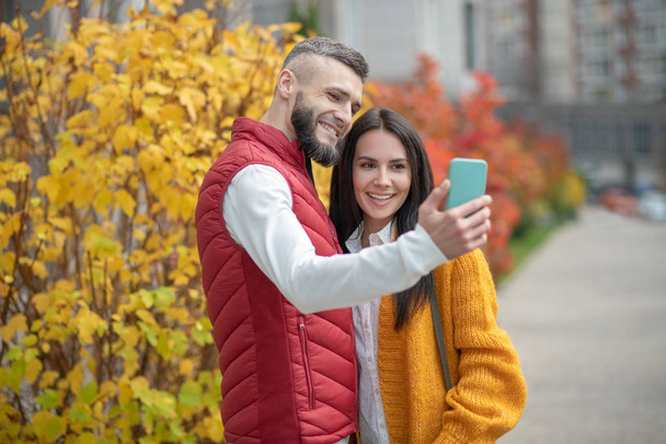 Joyful positive couple taking a selfie together - Foto, Imagem