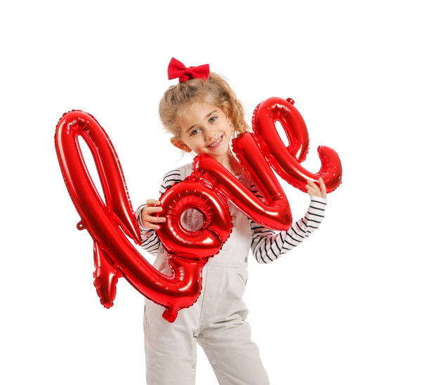 Cute little girl with air balloon in shape of word LOVE on white background. Valentines Day celebration - Fotoğraf, Görsel