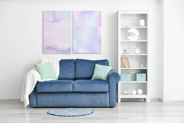 Stylish interior of living room with big sofa - Фото, изображение
