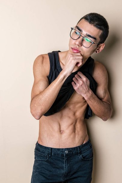 Young sexy man in glasses posing and show your body - Фото, зображення