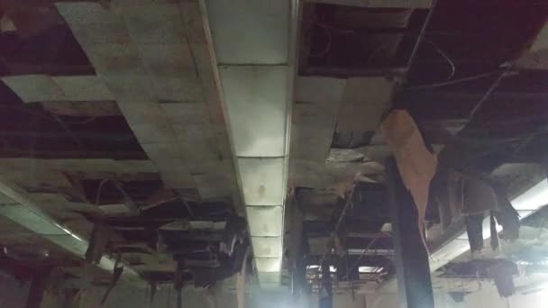 Gliding shot of destroyed ceiling after water leaked through - Filmati, video