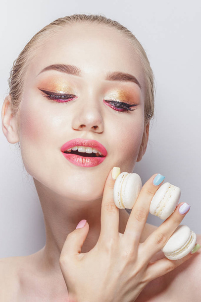 Portrait of beautiful woman with macarons - Photo, Image