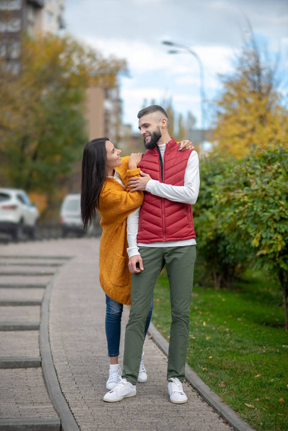 Positive delighted couple having a walk on the street - Foto, Bild