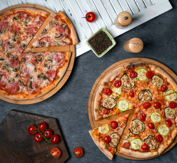 pizza with mushrooms and tomato and pizza with zucchini and - Foto, Imagen