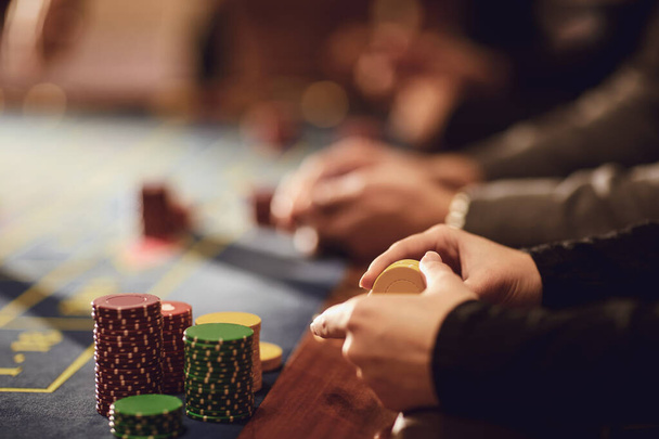 People play casino poker at a table in a casino. - Foto, Imagem