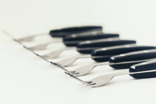 Close up six forks isolated on white background. - 写真・画像