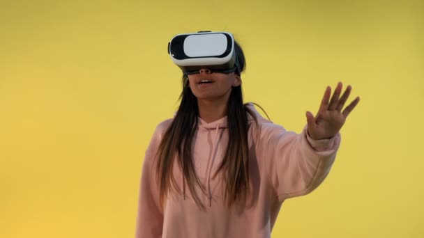 Multiracial girl using virtual reality glasses - Materiał filmowy, wideo