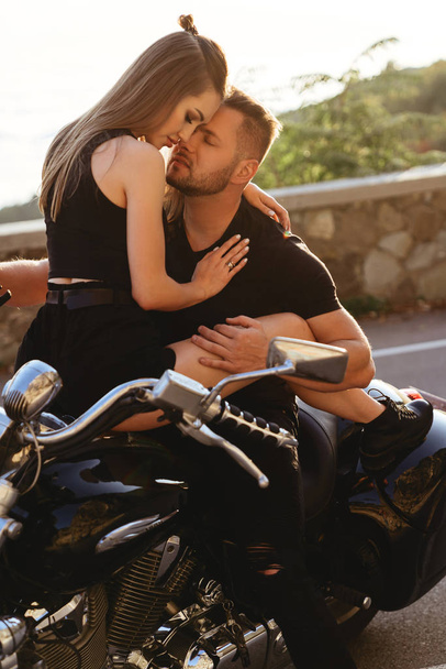 Couple of lovers kissing and hugging on motorbike - Fotó, kép