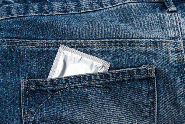 Condoms in package in jeans. - Photo, Image