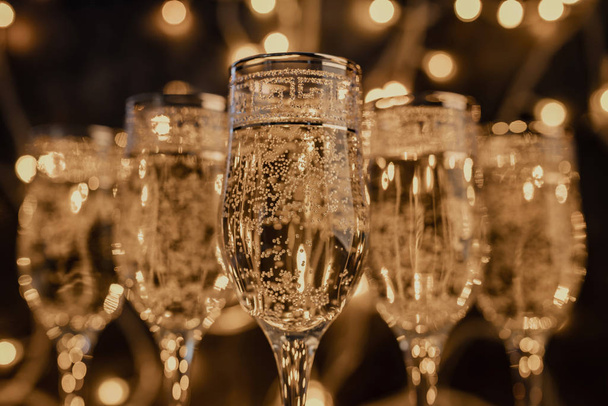 glasses of champagne on dark background with lights - Photo, Image