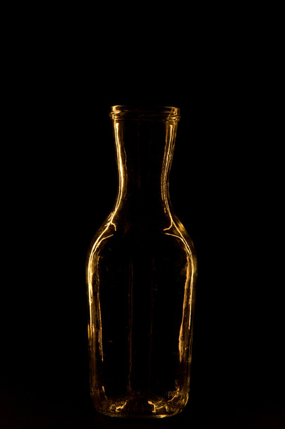 bottle on a black background - Fotó, kép