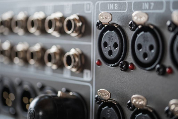 A closeup of professional audio engineering studio equipment used to record podcasts and live sound - Foto, Imagem