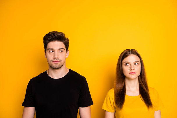 Photo of suspicious thinking pondering couple uncertain about each other looking suspiciously suspecting isolated over vibrant shiny color background - Fotoğraf, Görsel
