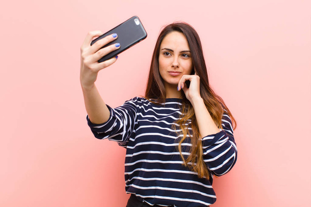 young pretty woman using her smart telephone - Φωτογραφία, εικόνα