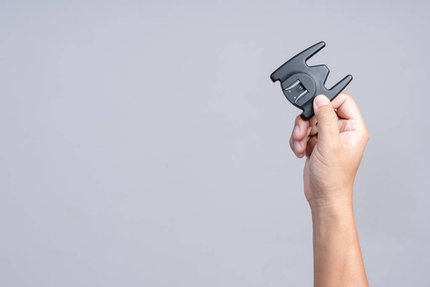 Hand holding portable speedlight flash stand - Фото, изображение
