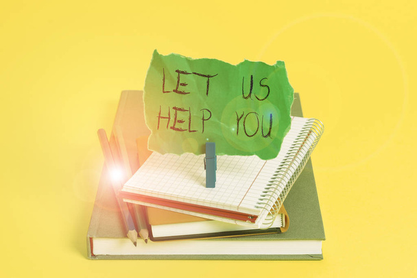 Text sign showing Let Us Help You. Conceptual photo Offering a service to someone to help him in his necessity Book pencil rectangle shaped reminder notebook clothespin office supplies. - Photo, Image