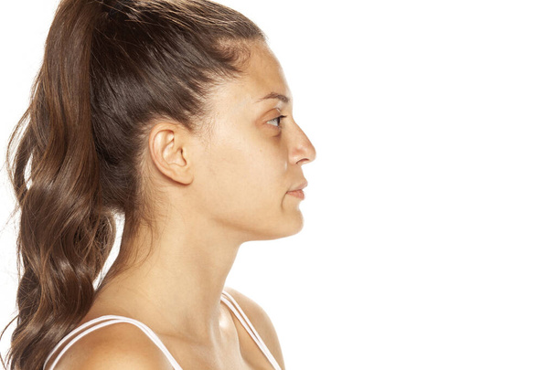 Profile of bautiful young woman without makeup on white backgrou - Fotoğraf, Görsel