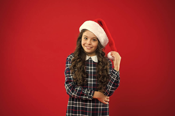 You are next. Present for Xmas. Childhood. New year party. Santa claus kid. Christmas shopping. Happy winter holidays. Small girl. Little girl child in santa red hat - Zdjęcie, obraz