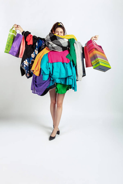 Woman addicted of sales and clothes, overproduction and crazy demand - Photo, Image
