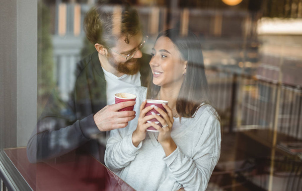 Happy couple enjoying coffee during date - Zdjęcie, obraz